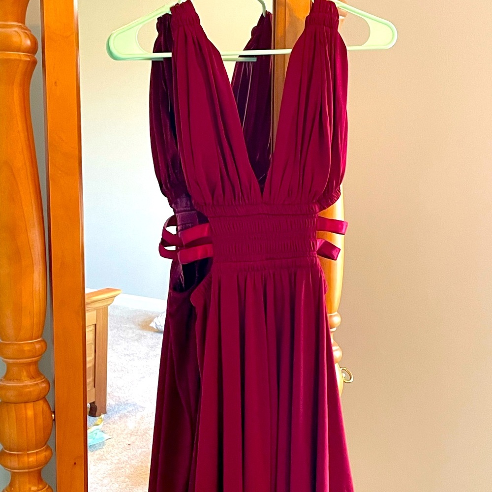 XS red dress from Express, flow with form fitting top and cutouts